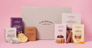 Selection of festive hamper gift boxes with assorted food treats